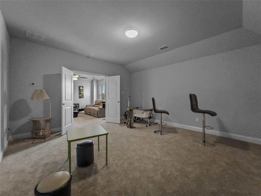 116 Chaco Drive Forney, TX 75126 - Photo 18 of 27 a living room with furniture and a rug