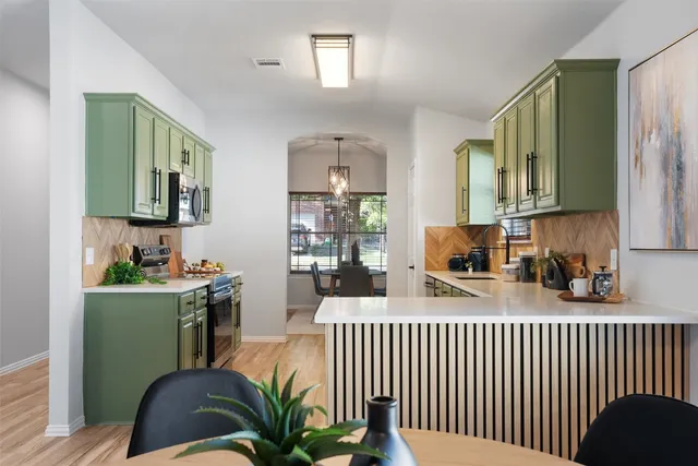 a bedroom with a bed and a wooden floor