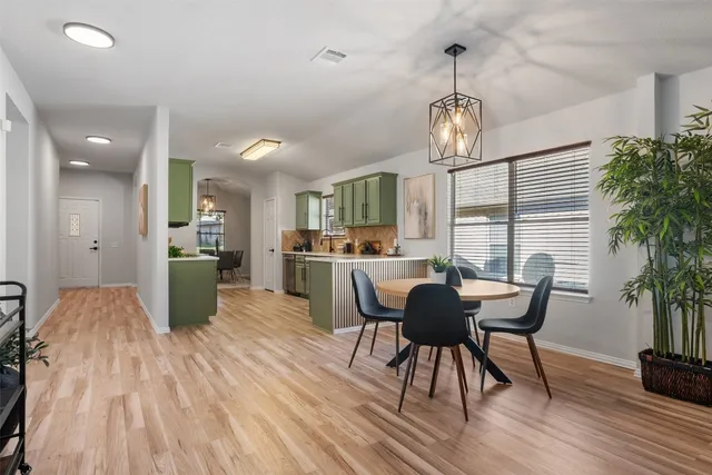 a living room with furniture a rug and a window