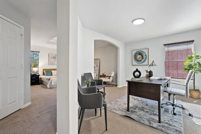 a living room with furniture and a table