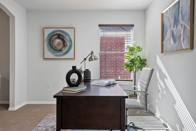 a view of a workspace with furniture