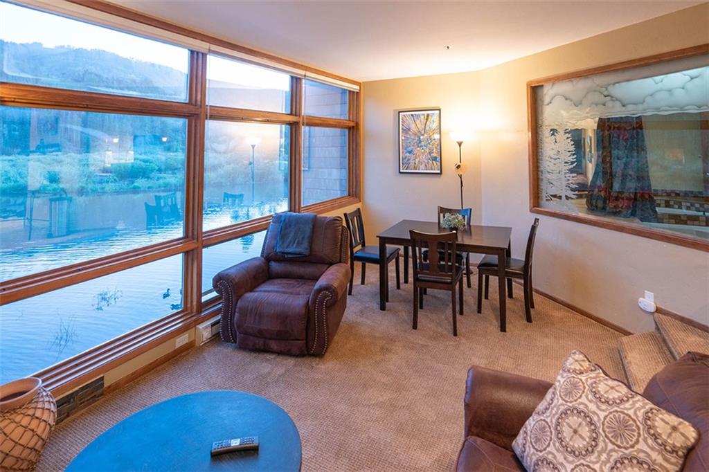 a view of a livingroom with furniture and window