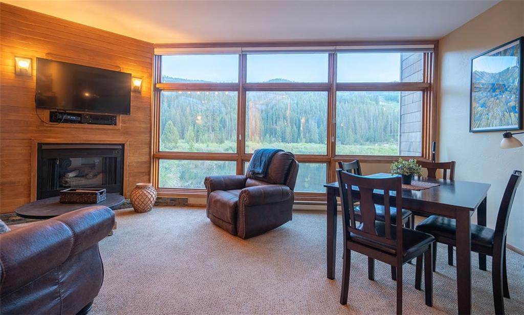 24 River Run Road, Unit 2906 Keystone, CO 80435 - Photo 3 of 15 a living room with furniture a fireplace and a flat screen tv