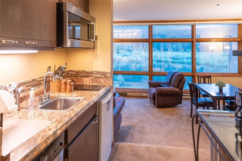 24 River Run Road, Unit 2906 Keystone, CO 80435 - Photo 4 of 15 a kitchen with a sink and a large window