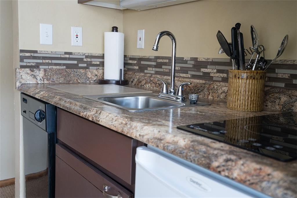 24 River Run Road, Unit 2906 Keystone, CO 80435 - Photo 5 of 15 a kitchen with sink a counter and cabinets