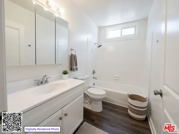 a bathroom with a sink a toilet and a bathtub