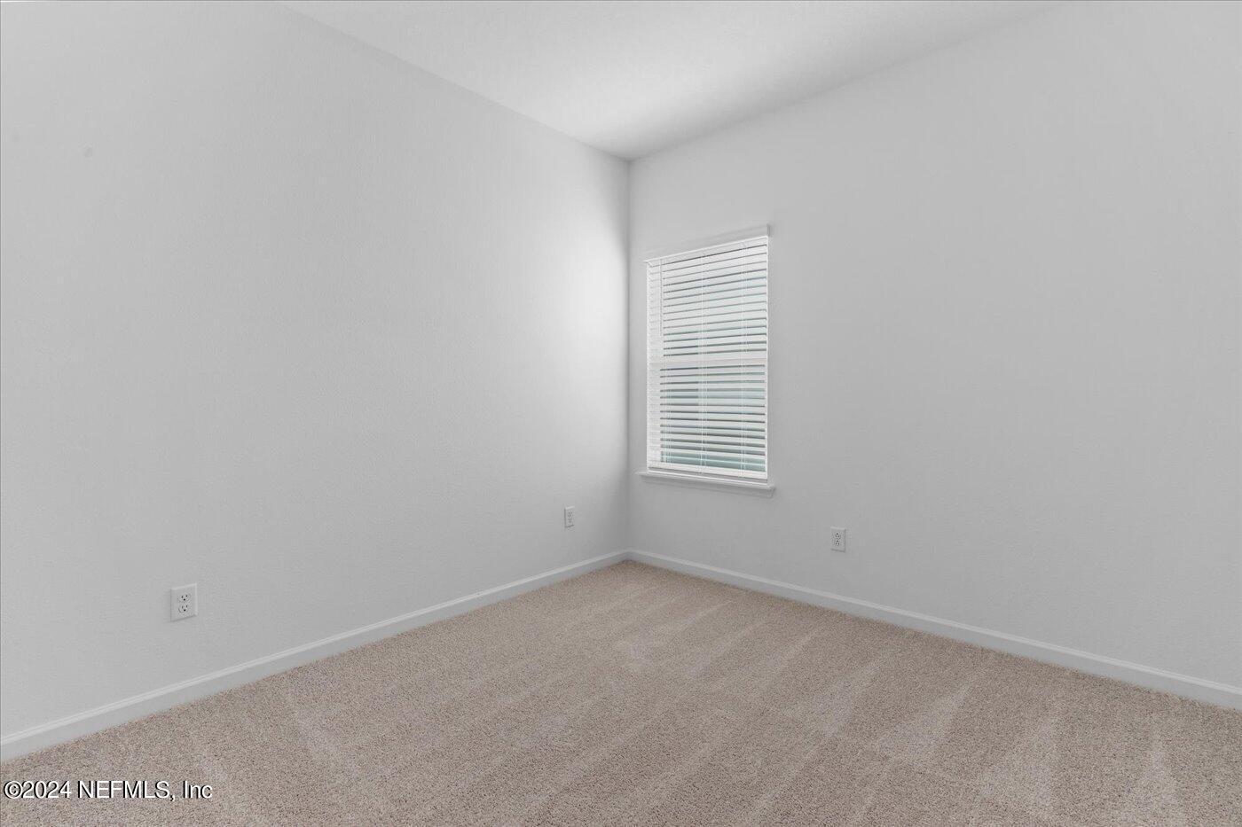 214 Blue Cypress Trail St. Augustine, FL 32084 - Photo 18 of 28 an empty room with windows