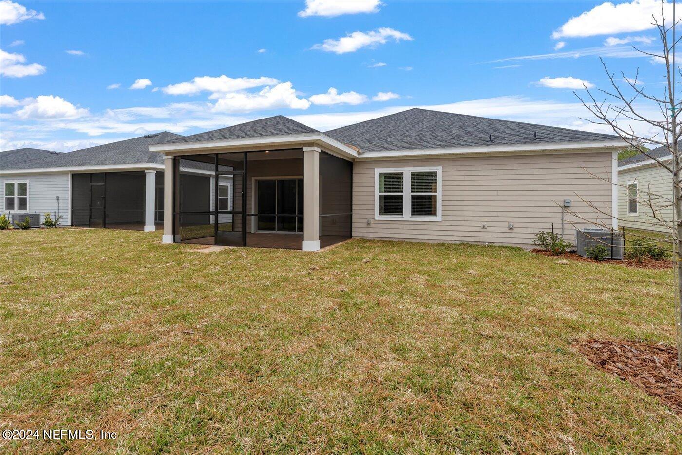 214 Blue Cypress Trail St. Augustine, FL 32084 - Photo 27 of 28 a view of a house with a garden