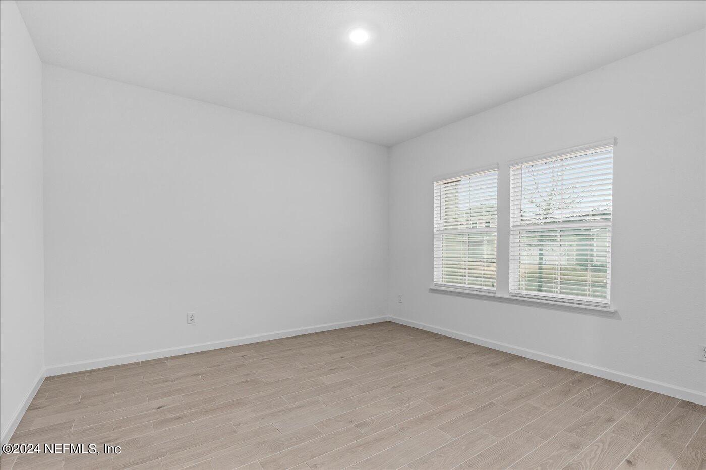 214 Blue Cypress Trail St. Augustine, FL 32084 - Photo 8 of 28 an empty room with a window