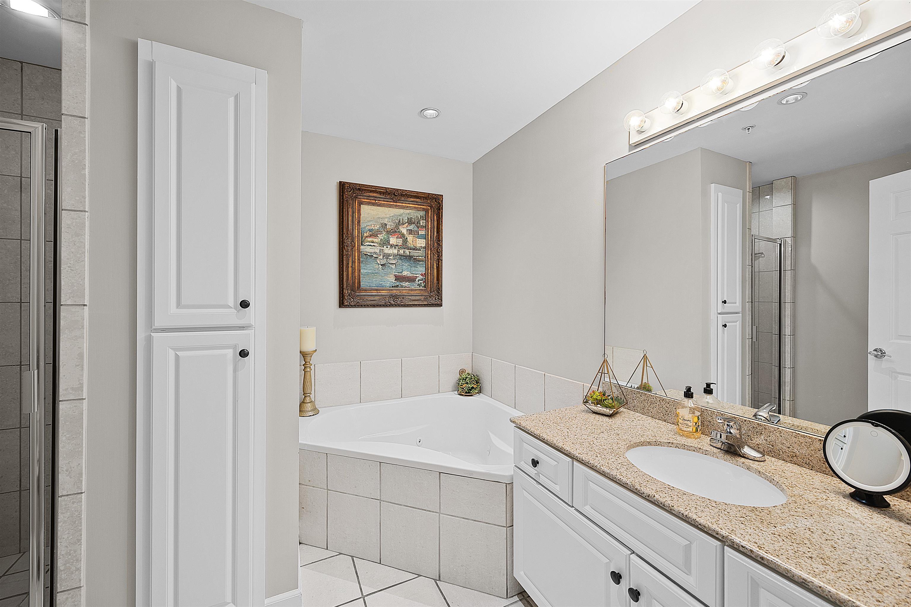 25 Cr 380 Road, Unit P 204 Iuka, MS 38852 - Photo 14 of 19 a bathroom with a granite countertop double vanity sink mirror and