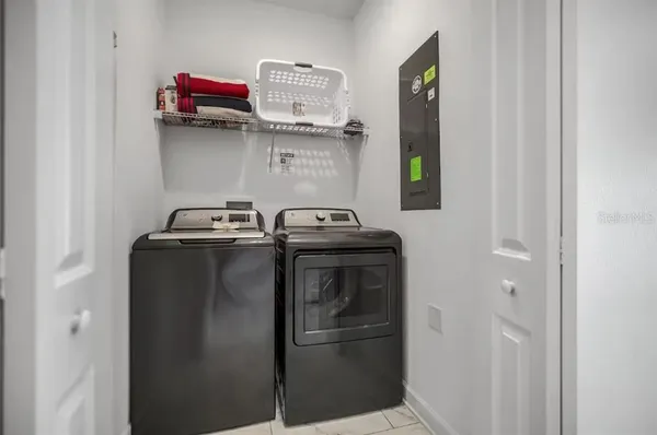 a utility room with dryer and washer