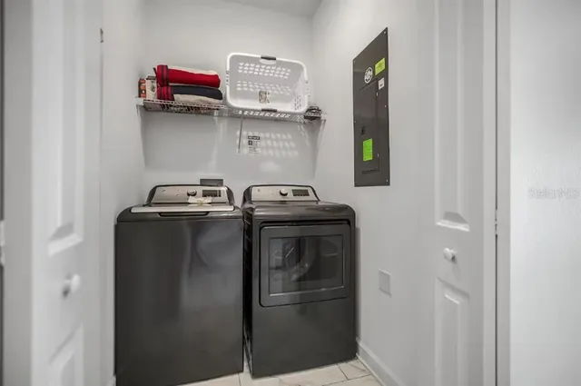 a utility room with dryer and washer