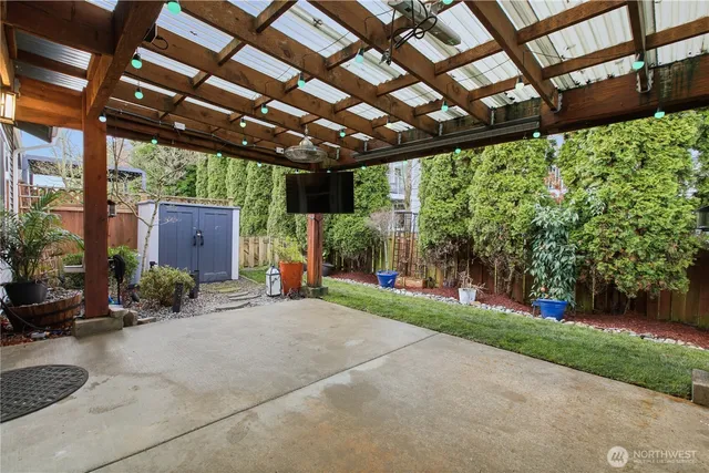 a view of a backyard with plants and a garden
