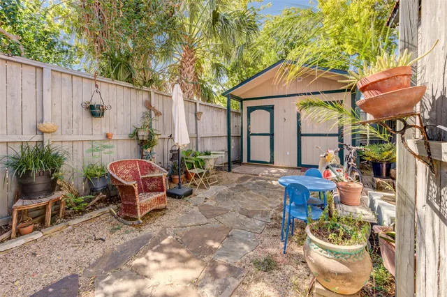 a backyard of a house with outdoor seating