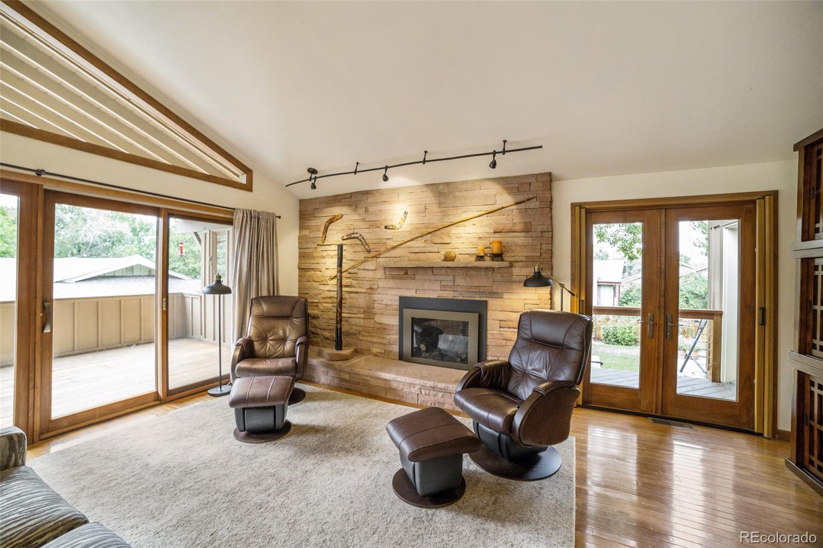 4780 McKinley Drive Boulder, CO 80303 - Photo 11 of 37 a living room with furniture and a fireplace
