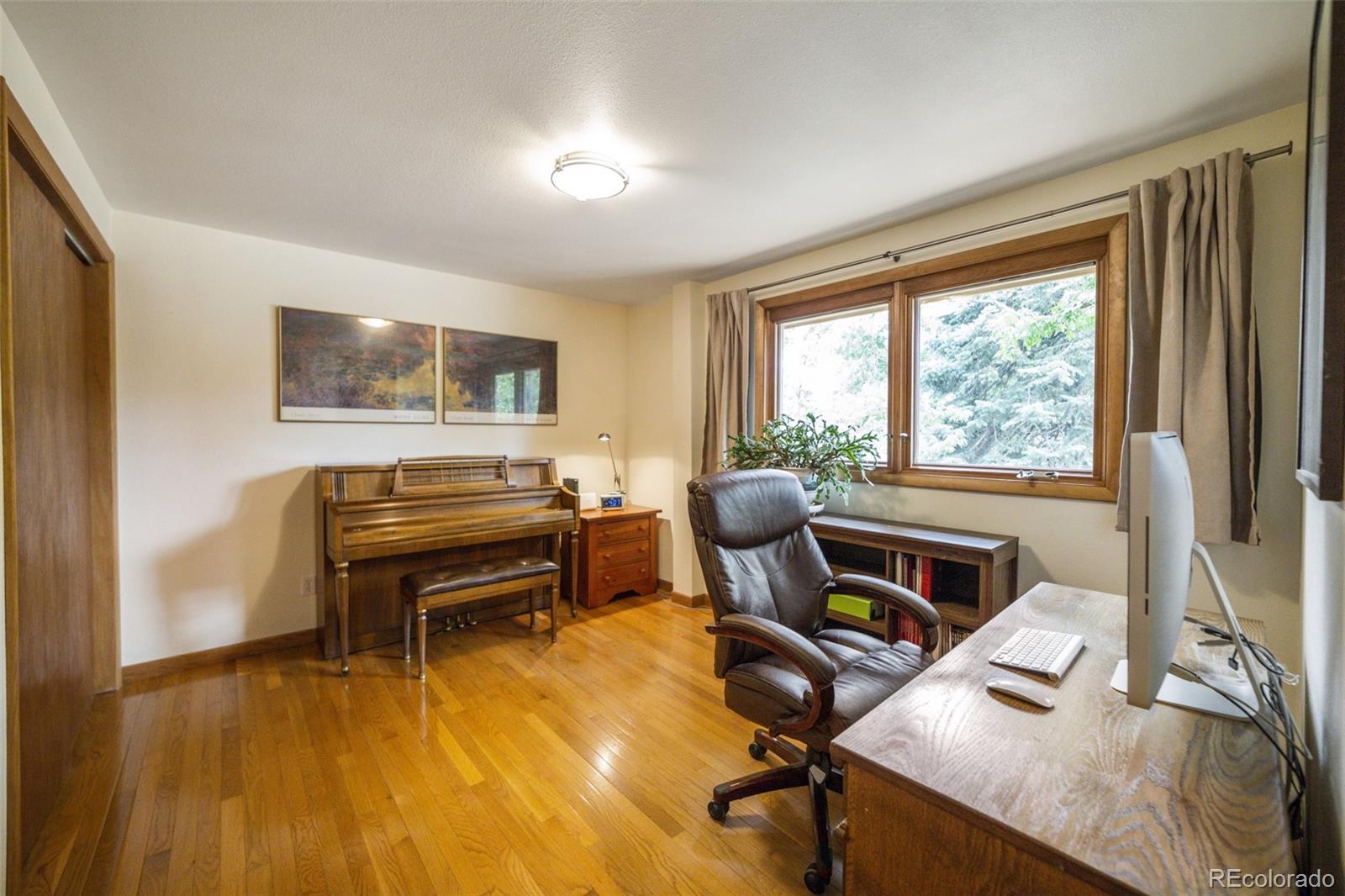 4780 McKinley Drive Boulder, CO 80303 - Photo 15 of 37 a work room with furniture and a flat screen tv