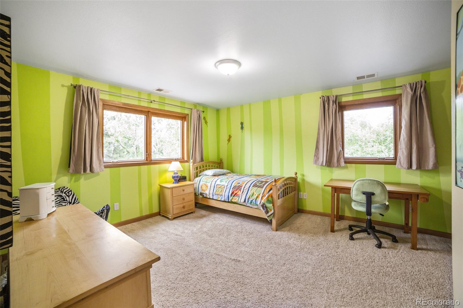 4780 McKinley Drive Boulder, CO 80303 - Photo 17 of 37 a bedroom with a bed and a window
