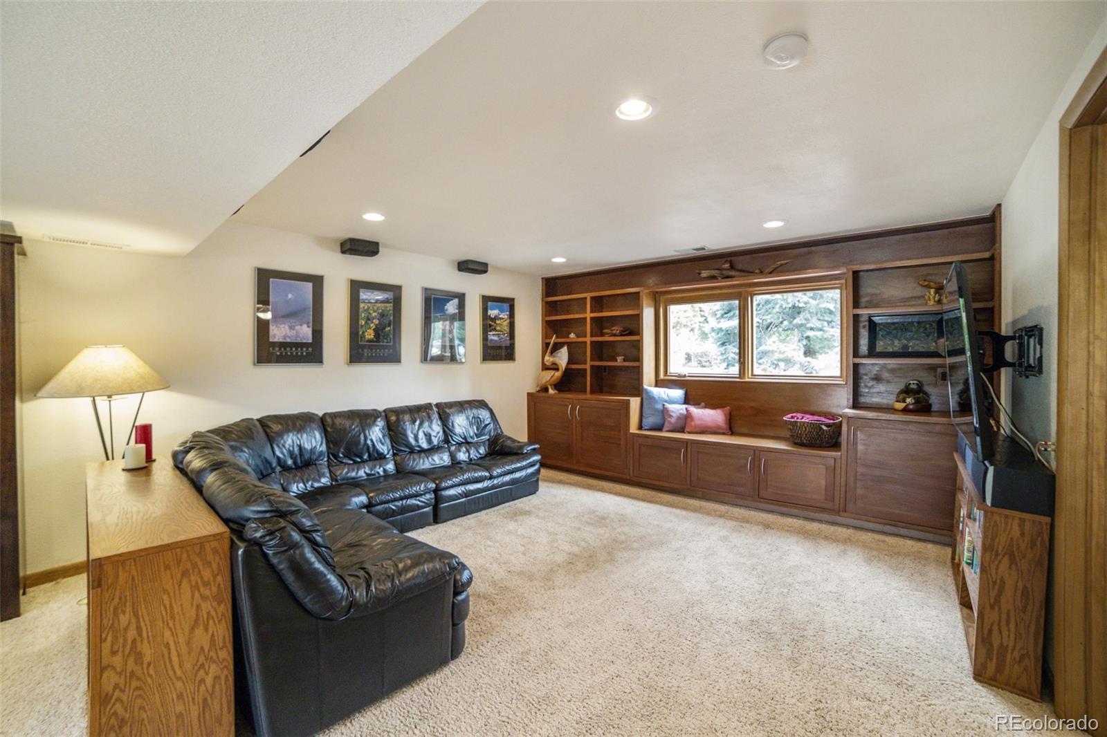 4780 McKinley Drive Boulder, CO 80303 - Photo 21 of 37 a living room with furniture and a flat screen tv