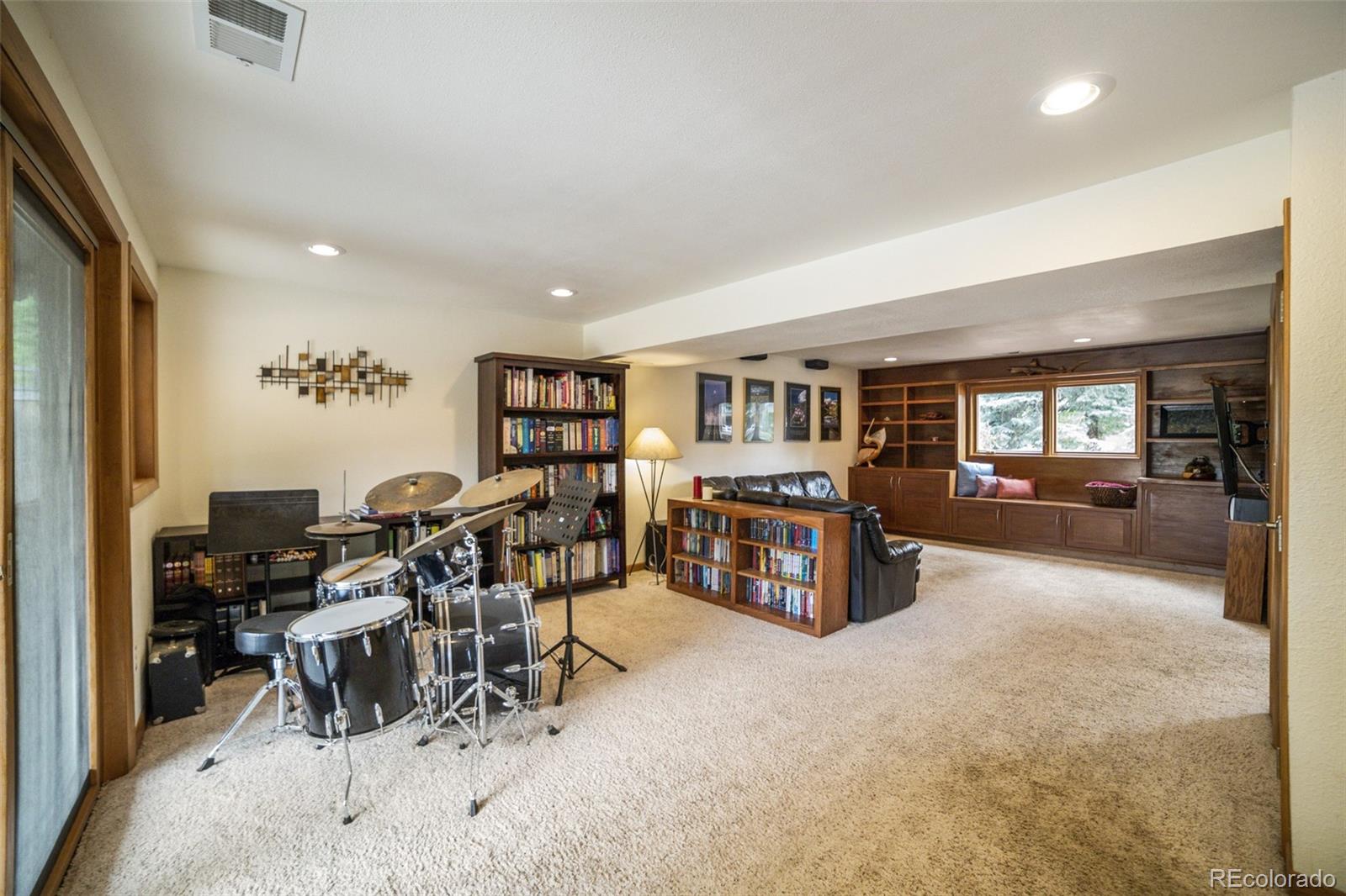 4780 McKinley Drive Boulder, CO 80303 - Photo 22 of 37 a living room with furniture and a table