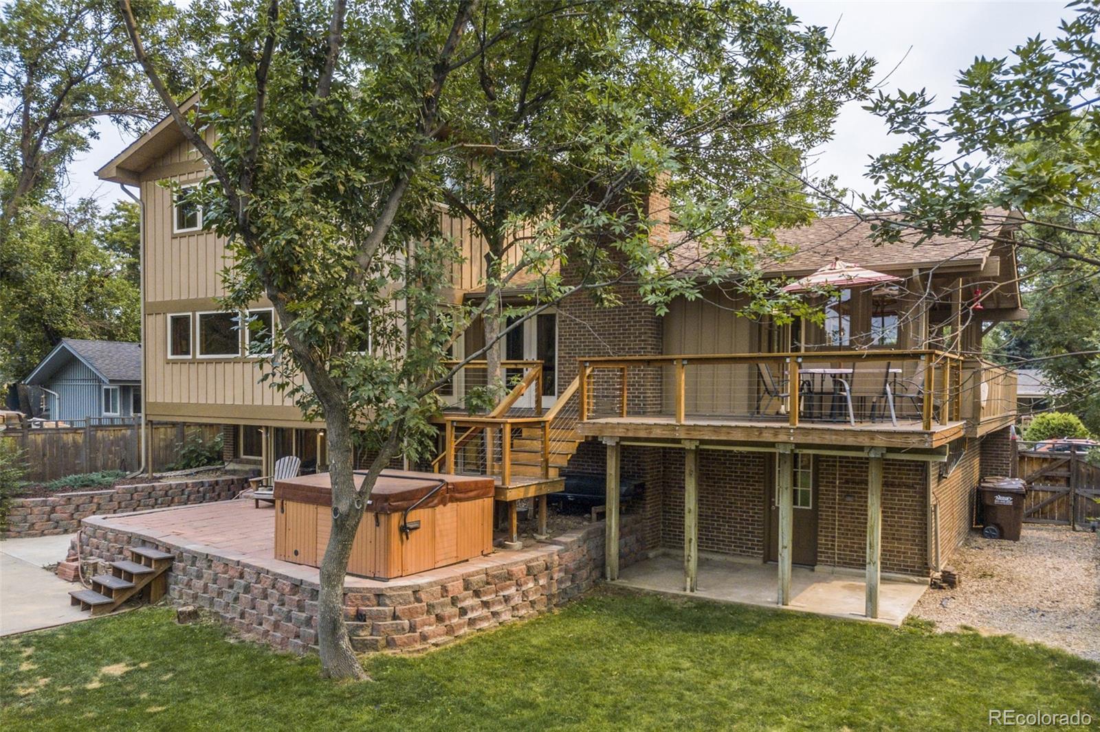 4780 McKinley Drive Boulder, CO 80303 - Photo 26 of 37 a view of a house with backyard porch and sitting area