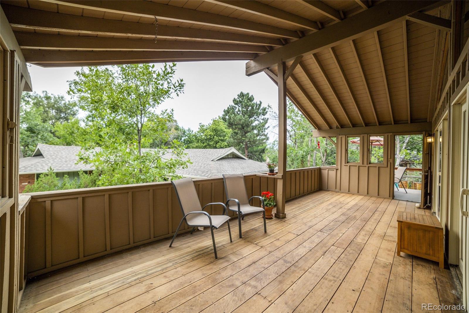 4780 McKinley Drive Boulder, CO 80303 - Photo 31 of 37 a balcony with furniture and wooden floor