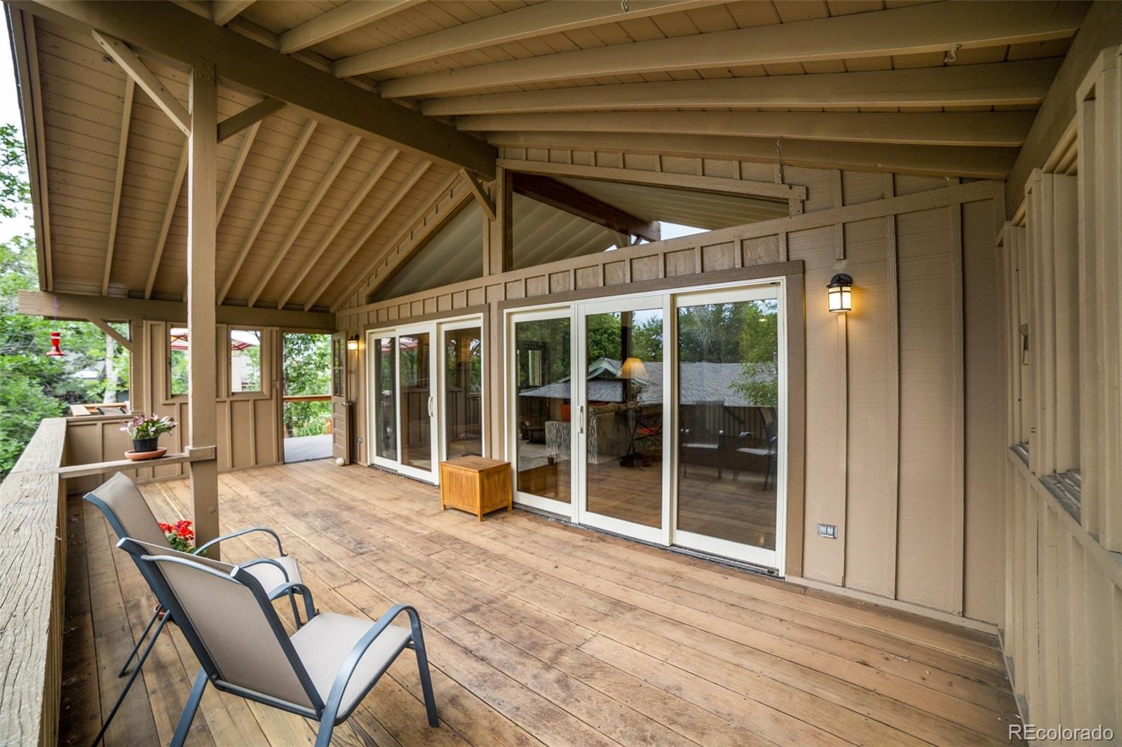 4780 McKinley Drive Boulder, CO 80303 - Photo 32 of 37 a view of a house with backyard porch and sitting area