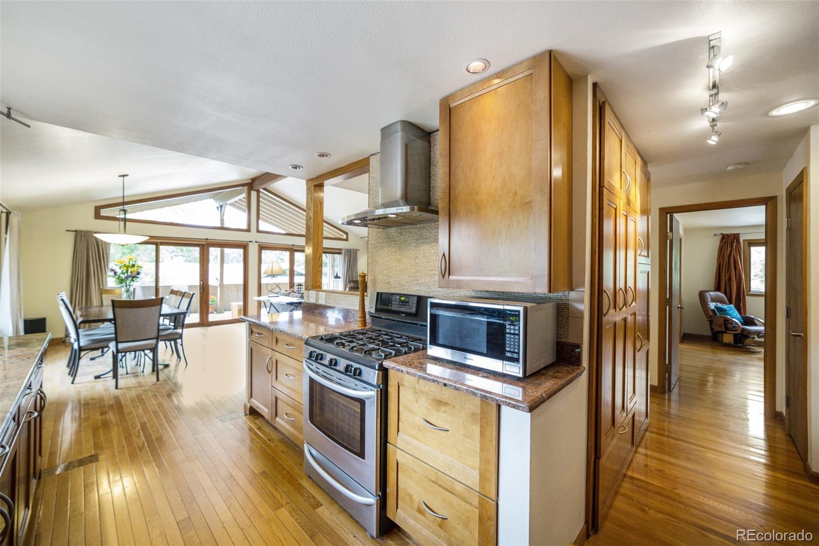 4780 McKinley Drive Boulder, CO 80303 - Photo 5 of 37 a kitchen with stainless steel appliances granite countertop a stove and cabinets