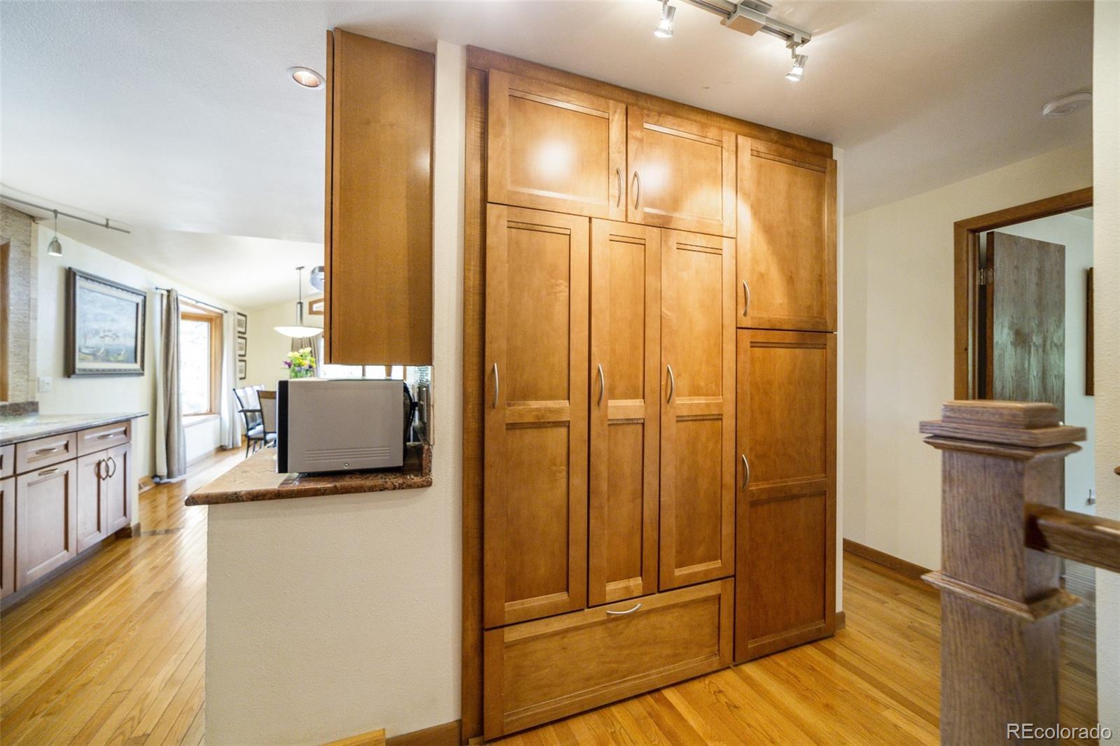 4780 McKinley Drive Boulder, CO 80303 - Photo 9 of 37 a view of a kitchen with furniture and wooden floor