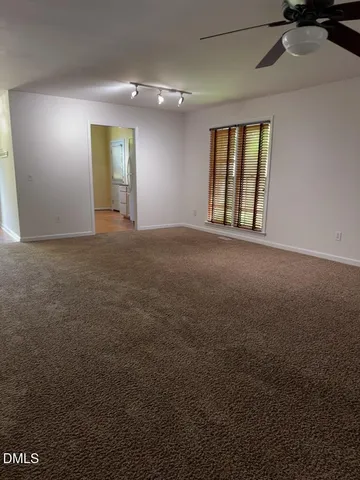 a view of an empty room and window