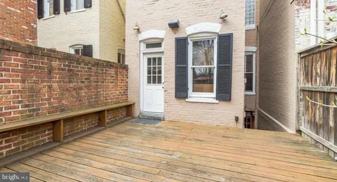 a view of a balcony with wooden floor