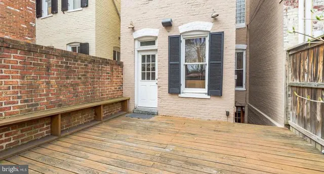 a view of a balcony with wooden floor
