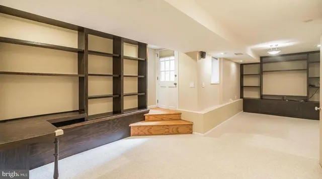 a living room with a couch and a flat screen tv