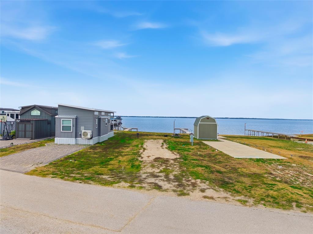 5224 Waterfront Road Kerens, TX 75144 - Photo 2 of 10 a view of a swimming pool with an outdoor space
