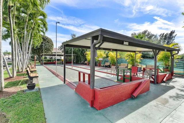 a view of a swimming pool with a patio