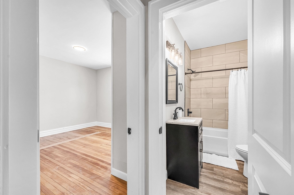 270 South Main Street Orange, MA 01364 - Photo 14 of 41 a view of a bathroom with a sink and mirror