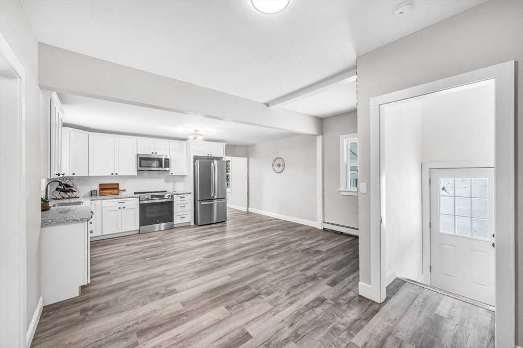 270 South Main Street Orange, MA 01364 - Photo 18 of 41 a view of kitchen with wooden floor