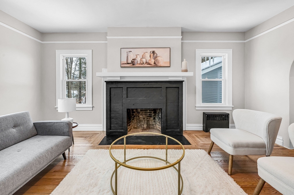 270 South Main Street Orange, MA 01364 - Photo 2 of 41 a living room with furniture and a fireplace
