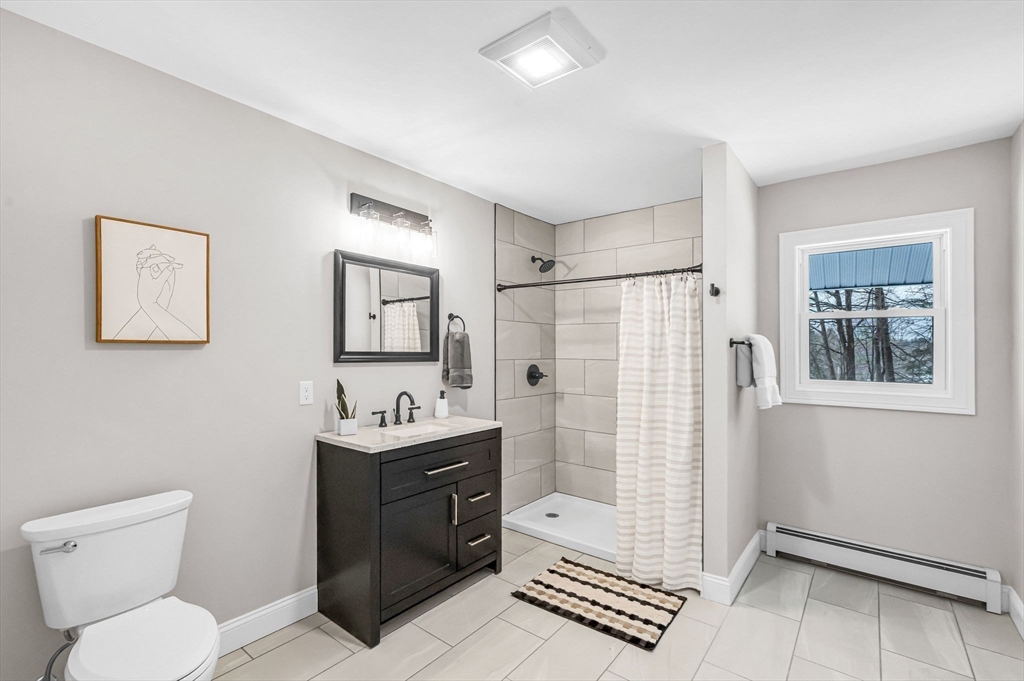 270 South Main Street Orange, MA 01364 - Photo 28 of 41 a bathroom with a sink toilet and shower