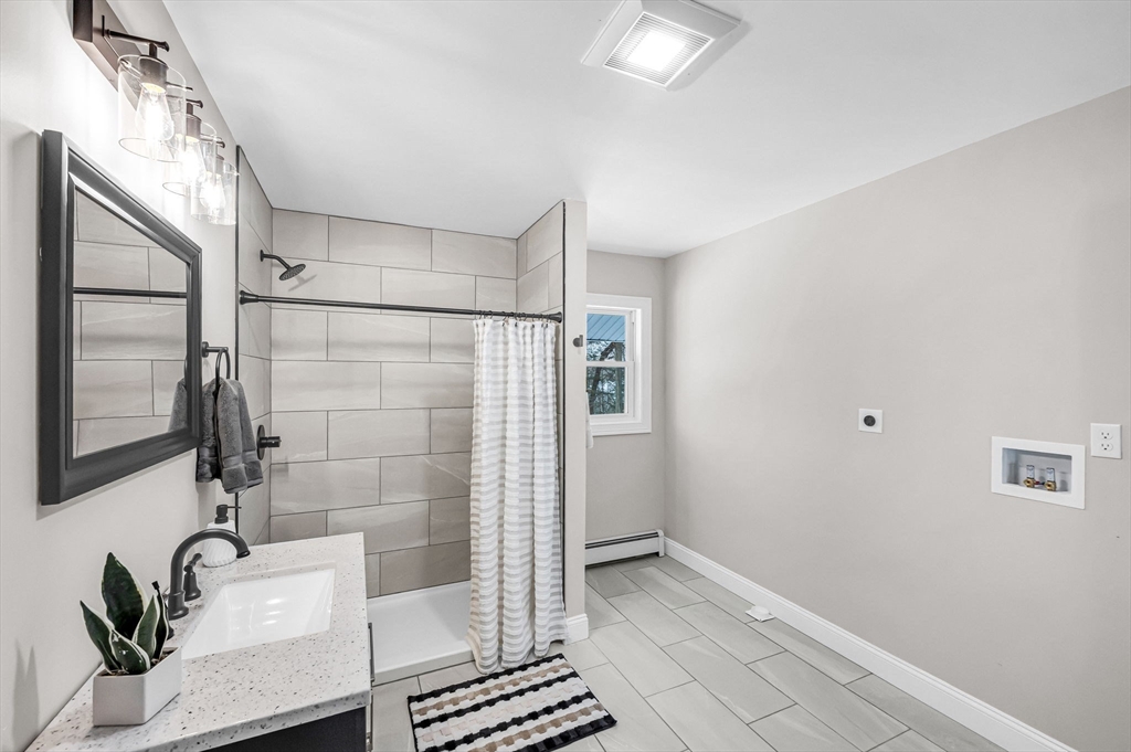 270 South Main Street Orange, MA 01364 - Photo 29 of 41 a bathroom with a bathtub and shower
