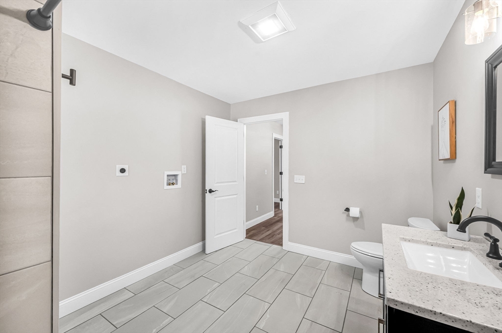 270 South Main Street Orange, MA 01364 - Photo 31 of 41 a bathroom with a sink and a mirror