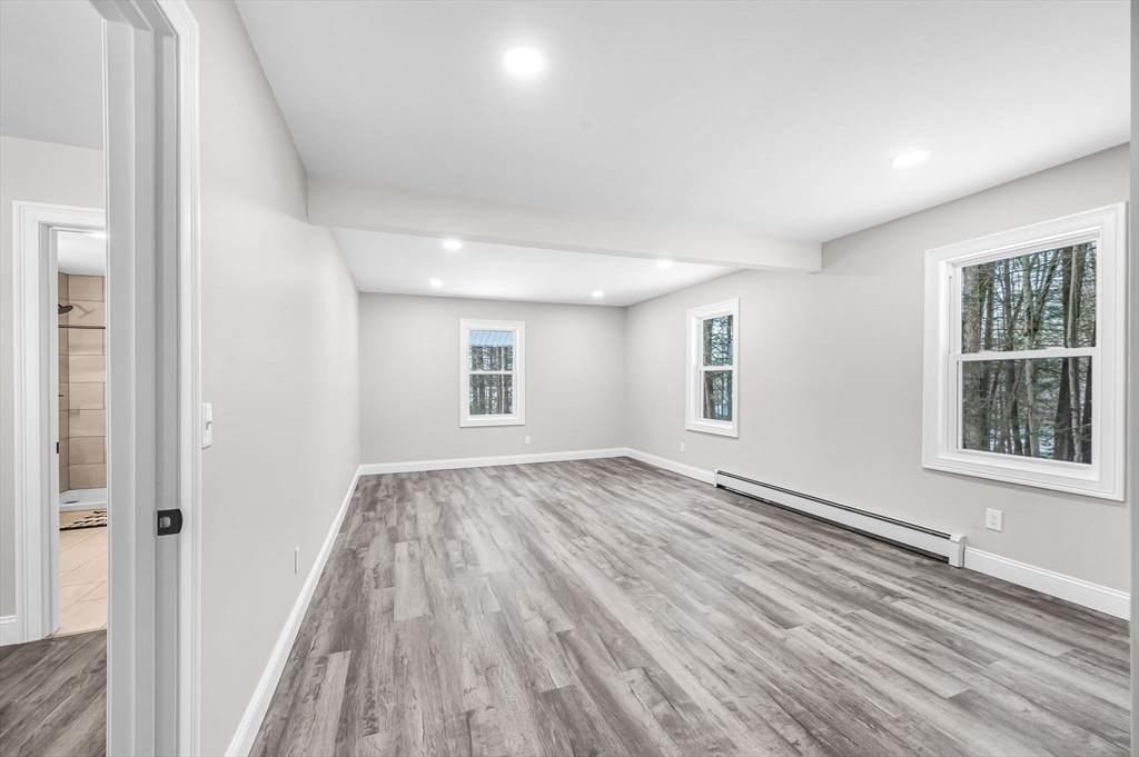 270 South Main Street Orange, MA 01364 - Photo 33 of 41 a view of an empty room with wooden floor and a window