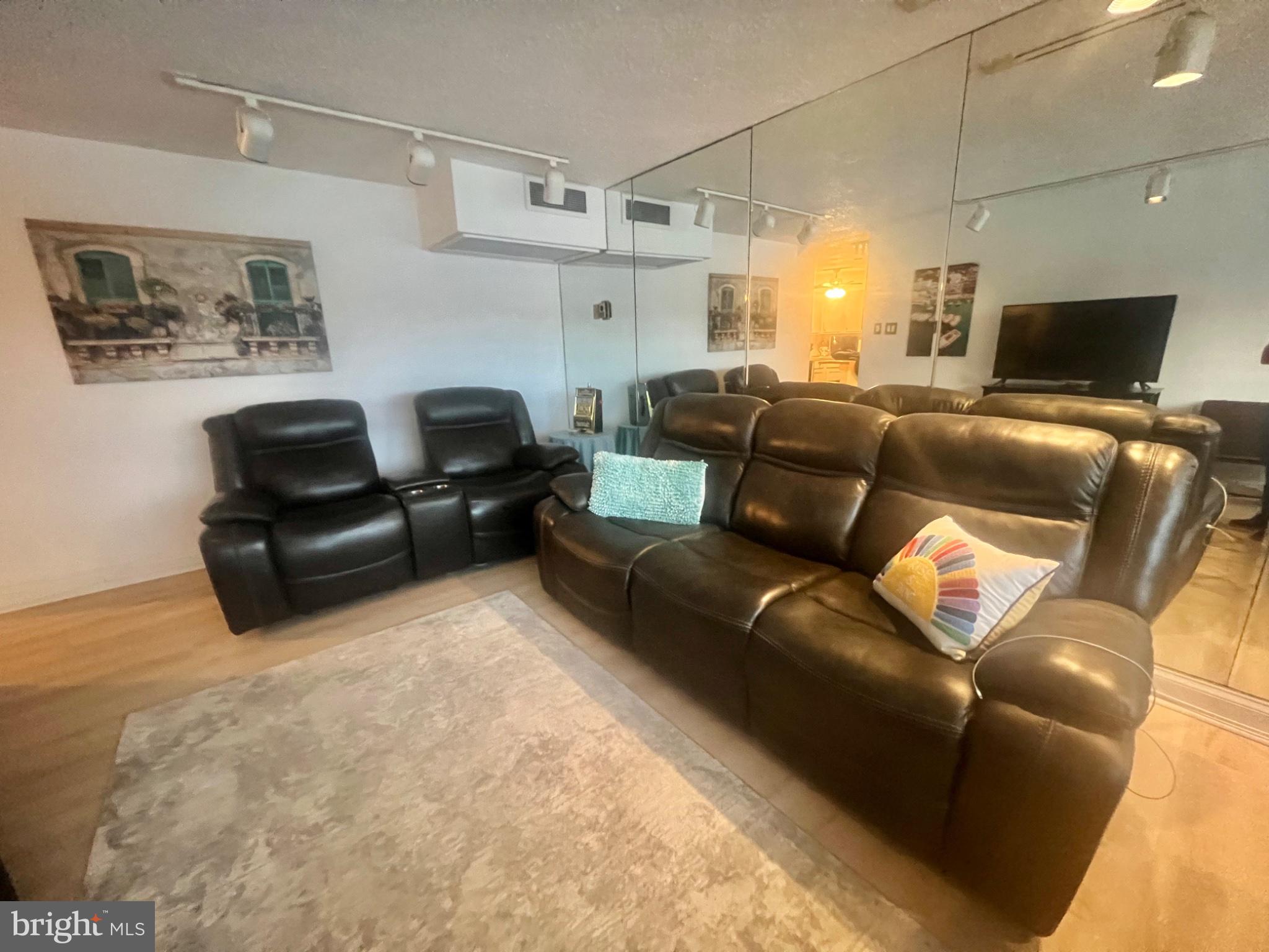 101 South Raleigh Avenue Atlantic City, NJ 08401 - Photo 12 of 24 a living room with furniture and a flat screen tv