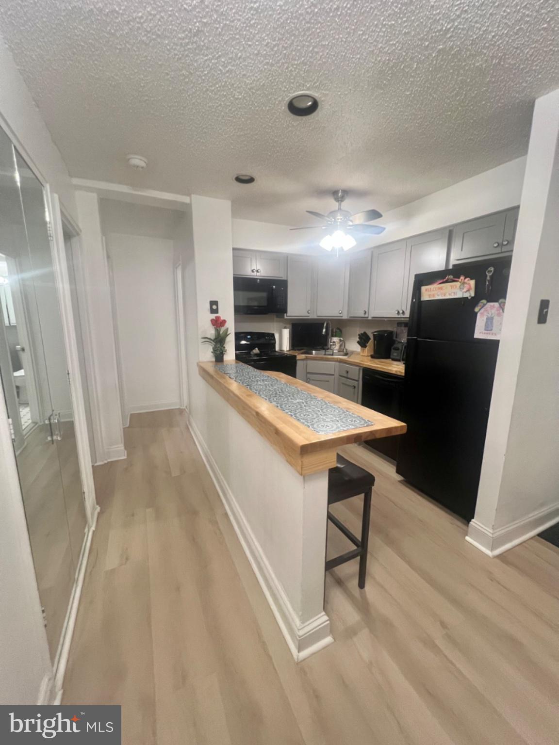 101 South Raleigh Avenue Atlantic City, NJ 08401 - Photo 2 of 24 a large kitchen with a table and chairs