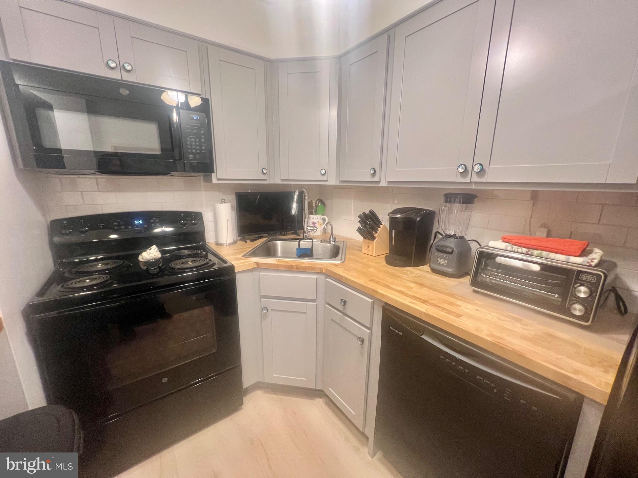 101 South Raleigh Avenue Atlantic City, NJ 08401 - Photo 4 of 24 a kitchen with a sink and cabinets