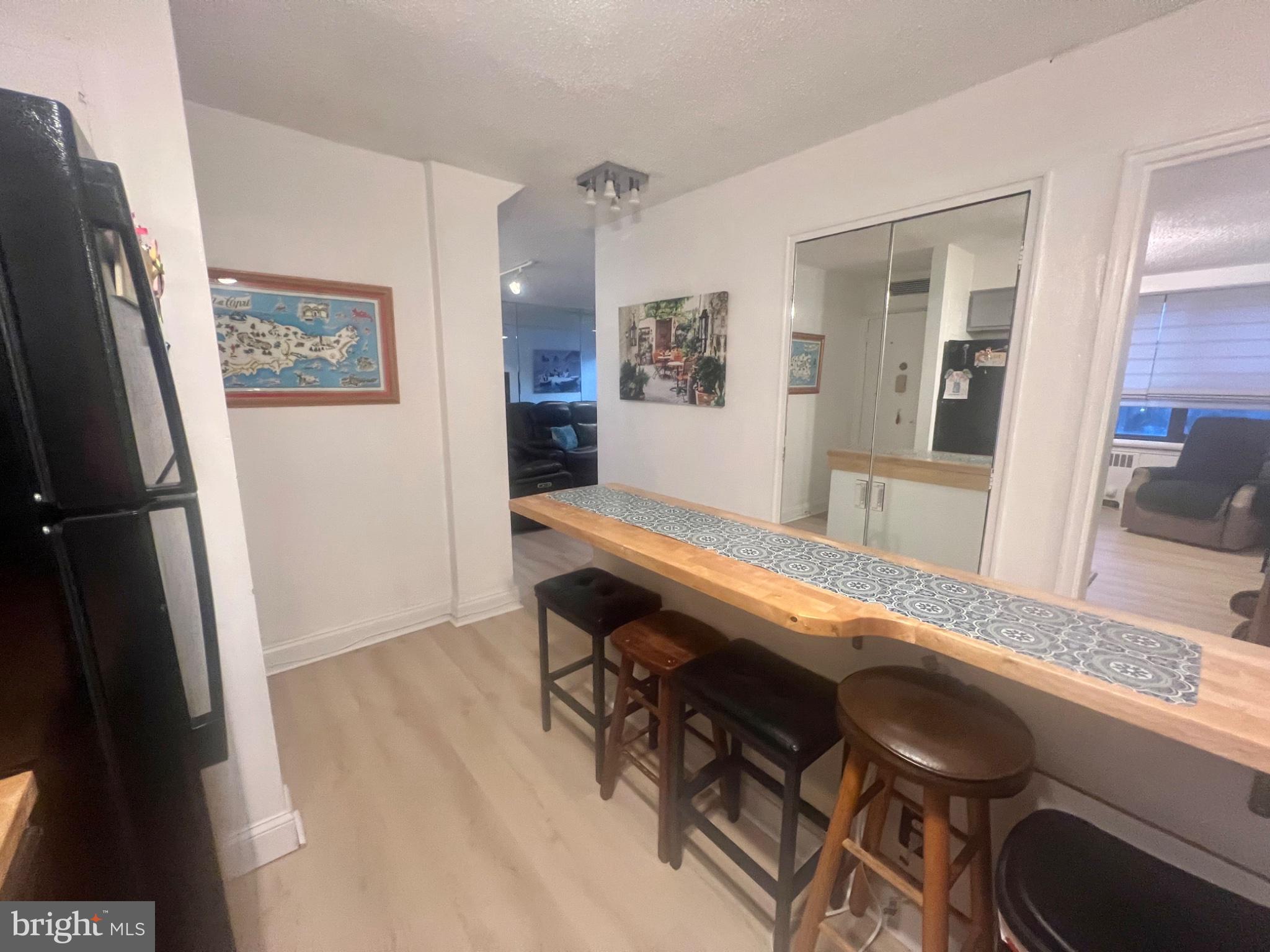 101 South Raleigh Avenue Atlantic City, NJ 08401 - Photo 6 of 24 a room with wooden floor and furniture