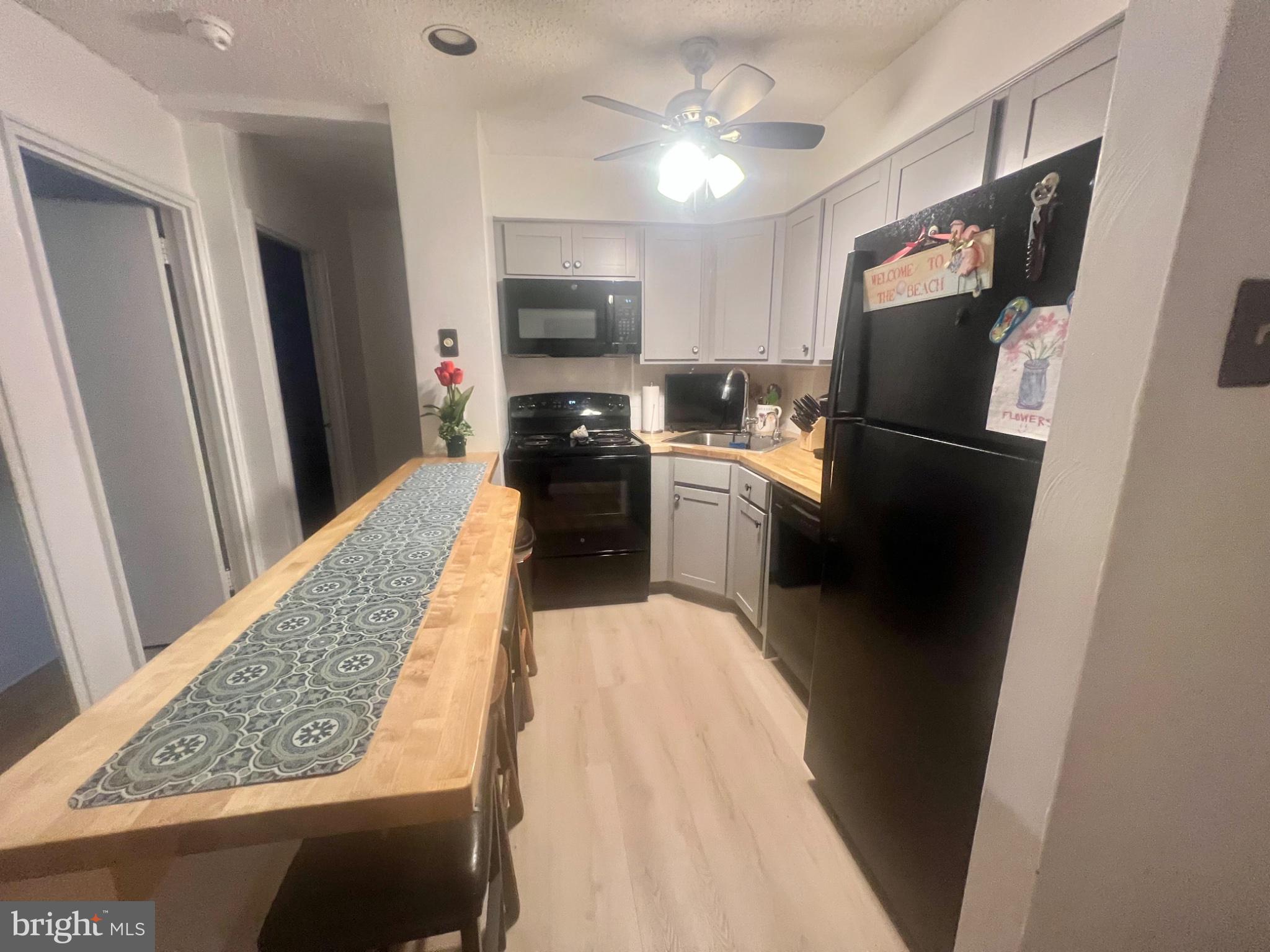 101 South Raleigh Avenue Atlantic City, NJ 08401 - Photo 8 of 24 a kitchen with stainless steel appliances granite countertop a refrigerator stove top oven a sink and dishwasher