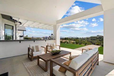 a front view of a house with a big yard
