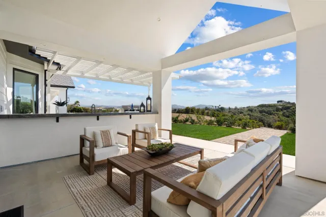 a front view of a house with a big yard