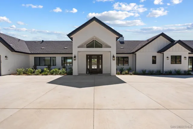 a front view of a house with garage
