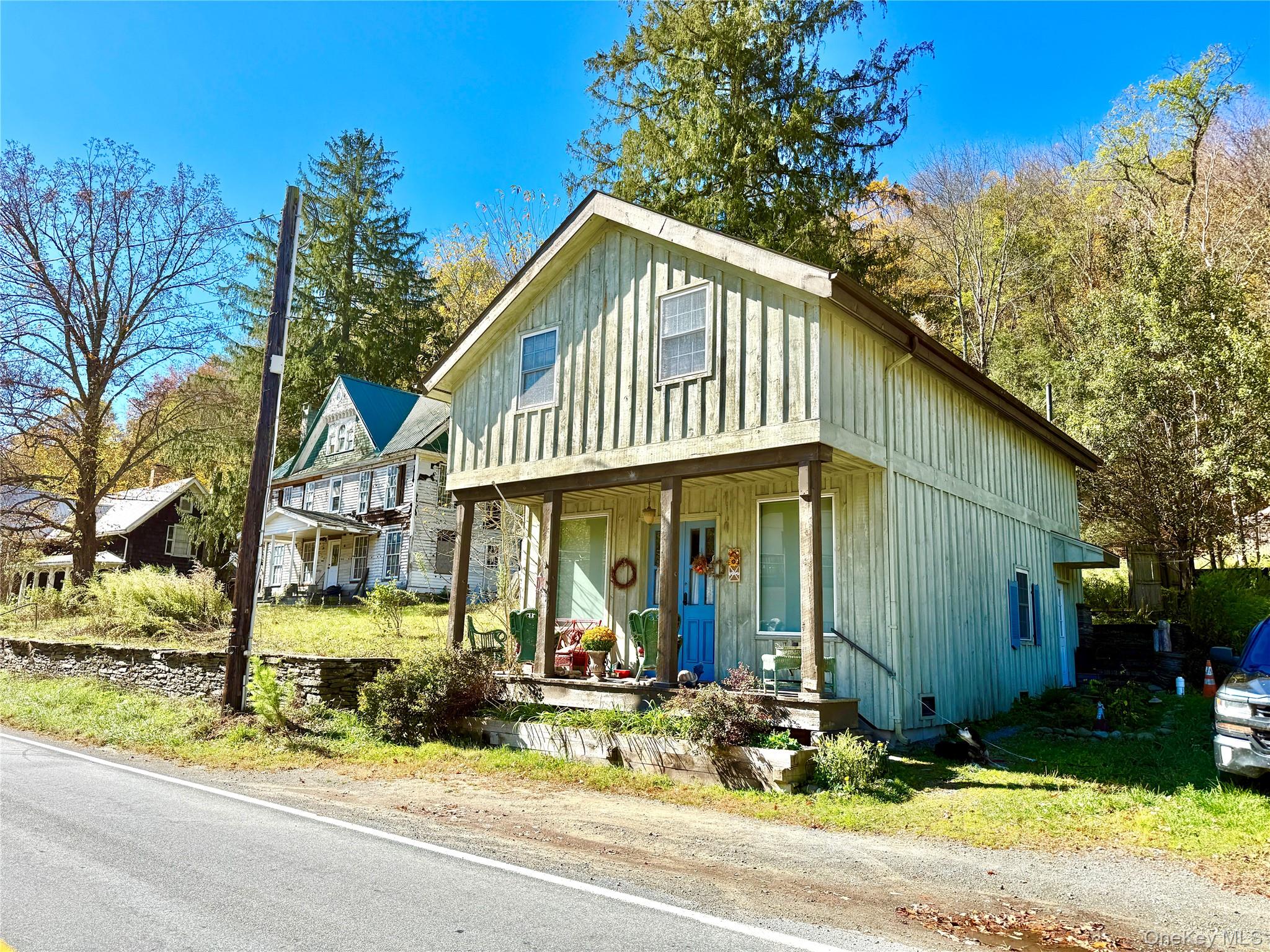 a view of a house with outdoor space and garden